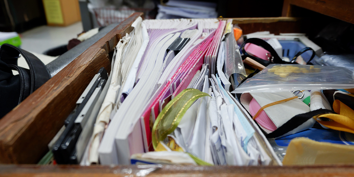 a drawer stuffed with paper