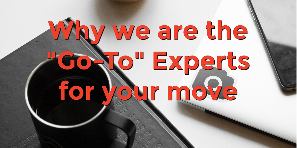 a table surface with a book, coffee cup and phone with text that reads, why we are the go-to experts for your move